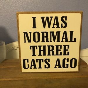Wood box saying “I was normal three cats ago”